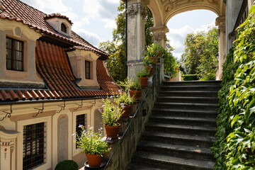 Prague, Czech Republic – August 6, 2025: Kolowrat Garden, Baroque garden terraces and stairway beside historic villas in Prague, Czech Republic on a sunny summer day