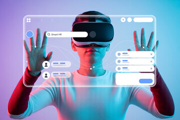 Person wearing a vr headset interacts with a smart hr interface showcasing augmented reality and virtual reality applications in human resources and future technology trends in business and education