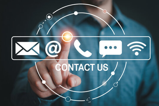 Man presses contact us button with email phone chat and wifi icons for customer support online communication and digital assistance on a virtual interface for business and technology needs