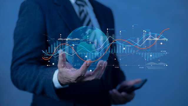 Businessman holding planet Earth with glowing chart. Graph stock market with rising candlesticks. Infographic elements and realistic transparent world map.