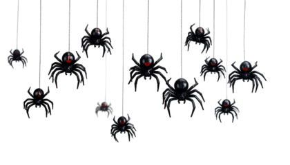 Hanging plastic spiders with glowing red eyes on string, set against a stark black background