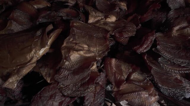 4K 60 FPS video of the process of making smoked fish, a food with traditional and environmentally friendly preservation practices in Merauke, Papua.