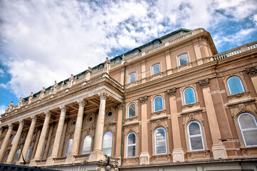Obraz premium Budapest, Hungary - July 28, 2025: Exteriors of the Budapest Castle — a restored Neo-Renaissance building complex in Budapest, Hungary, located on the Buda side of the Danube 