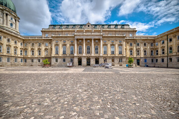 Obraz premium Budapest, Hungary - July 28, 2025: Exteriors of the Budapest Castle — a restored Neo-Renaissance building complex in Budapest, Hungary, located on the Buda side of the Danube 