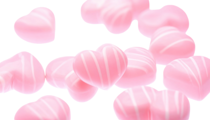 Pink, heart-shaped candies with white stripes float against a transparent background, blurred