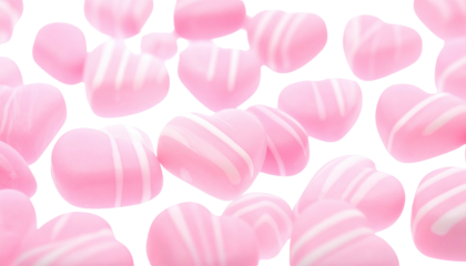 Soft pink heart candies, striped in white, floating against a solid black background