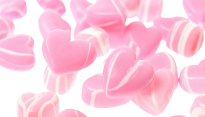 Pink heart-shaped candies with a glossy, polished texture against a black background