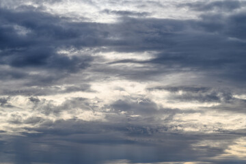 The Dramatic Evening Sky with Beautiful Cloud Patterns Creates an Enchanting Scene at Dusk