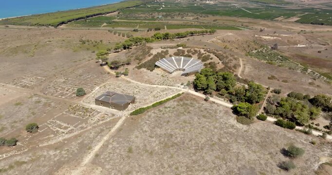 Aerial view of the archaeological site of Eraclea Minoa, located in the province of Agrigento, Sicily, Italy. Inside are the ruins of an ancient Greek amphitheater.