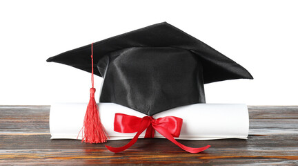 Diploma and graduation hat on wooden table against white background