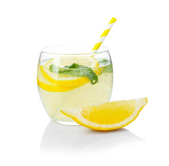 Refreshing lemonade with mint and fruit slices in glass isolated on white