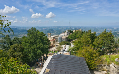 The towering stone fortress, Cesta, one of the three towers of San Marino, set against a blue sky.