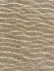 Sand texture. Waves on the sand. Sand in detail