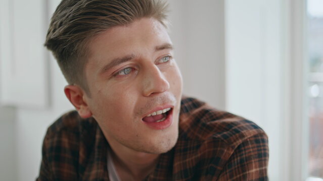 Closeup cheerful man talking friend. Happy handsome guy enjoying conversation
