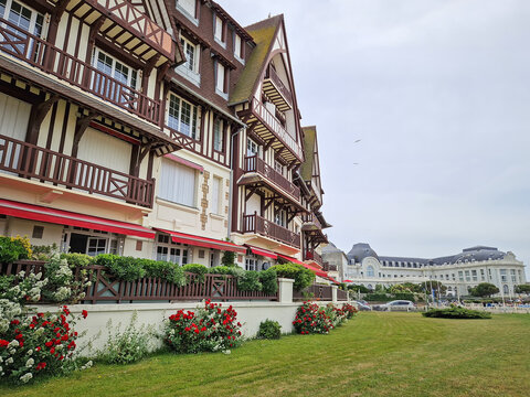 Trouville-sur-Mer, Normandy, France - May 31, 2025: Neo-Norman architecture of Trouville town. The facade is characterized by dark half-timbered beams over white stucco. Coastal resort building - Powered by Adobe