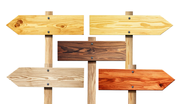 Wooden directional signs with multiple boards showing different colors against a black backdrop