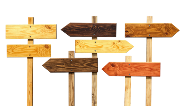 Assortment of arrow-shaped wooden directional signs in various wood tones against black