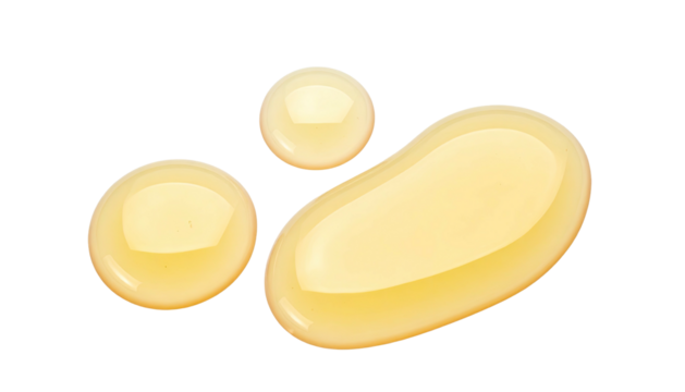 Three glistening, amber liquid drops against a stark black background, showcasing texture