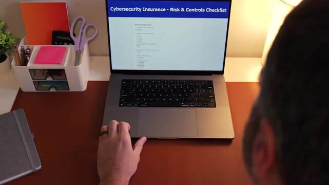 Information Security Analyst Completing Annual Cybersecurity Insurance Checklist for Corporate Employer - Concept