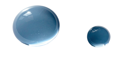 Two translucent, spherical bubbles against a stark black backdrop. They reflect light and sky
