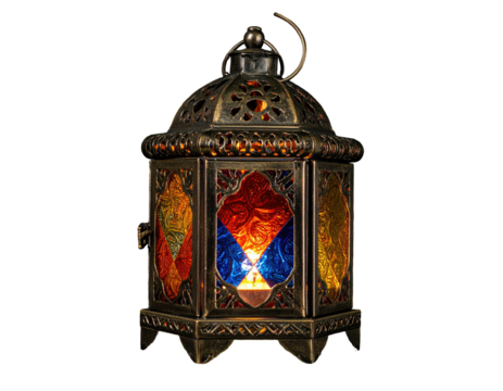 Ornate, multi-colored glass and metal lantern casting warm light on a solid black backdrop