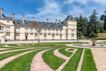 The Renaissance-style main facade of El Pardo Palace overlooking the formal gardens, featuring its...