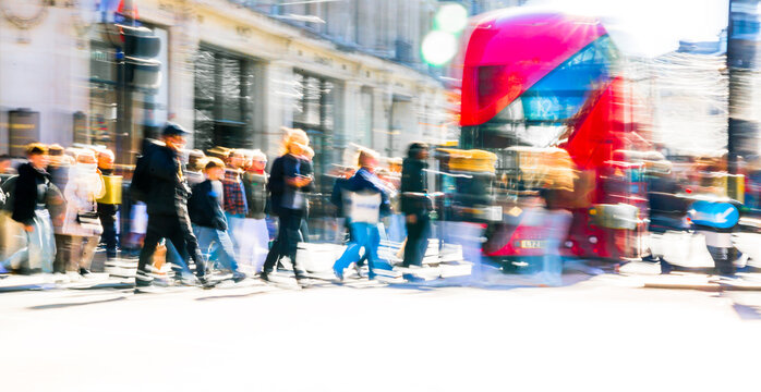Beautiful postmodernism  motion of people walking in London street at sunny day. Shoppers and tourists crossing Oxford circus