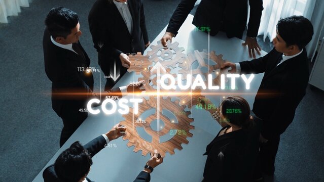 A diverse business team engages in a strategic meeting focused on achieving optimal cost, quality, and efficiency using interactive gear graphics in a modern office environment. Raster