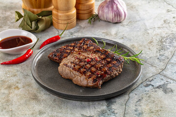 Grilled juicy beef steak with pepper