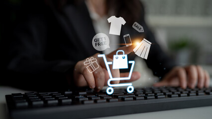 Glowing shopping cart with sale tags, clothing, and mobile items representing online retail...