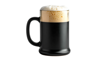 A full black beer mug with a thick creamy head of foam, isolated against a black background