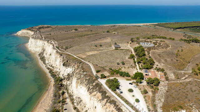 Aerial view of the archaeological site of Eraclea Minoa, located in the province of Agrigento, Sicily, Italy. It is located on a hill overlooking the azure waters of the Mediterranean Sea.