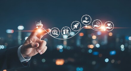 Businessmans hand touching a glowing line graph with business icons representing growth and success against a blurred city background at night