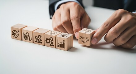 Hands Arranging Business Concept Blocks