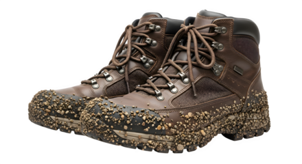 A pair of muddy brown leather hiking boots are shown isolated on transparent background, laces tied, ready for a trek, showcasing the wear and tear of outdoor adventures