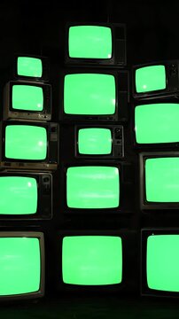 Stack of Possibilities with pile retro tvs green screen turning on and off distortion, overlay, glitch, static noise, scan lines black background, 4k animated video loop