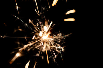 Bright Sparklers Burning on Pure Black Background