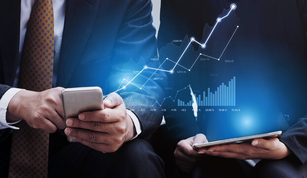 Two business professionals engage with financial data on mobile devices while a growth chart overlays the scene, symbolizing market trends and future success. Scalp
