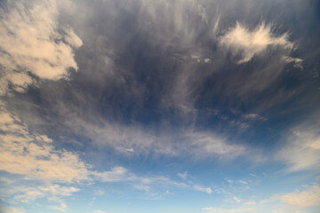 Clouds are Scattered Across a Beautiful Blue Sky, Creating Natures Magnificent Canvas