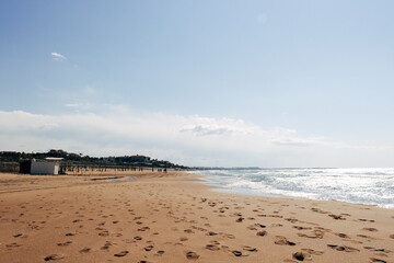Sunny Beach on a Vacation Day with Clear Blue Water