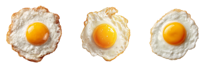 Three Fried Eggs with Bright Yellow Yolks and Crispy White Edges isolated on a transparent background