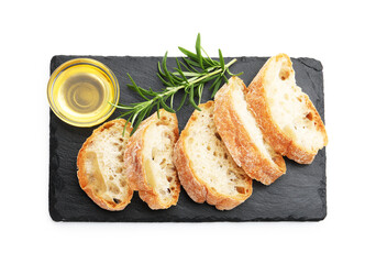 Slices of ciabatta, oil and rosemary isolated on white, top view