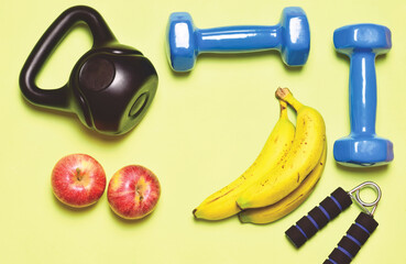 Zenith view. Physical activity and good nutrition, represented with sports accessories and fruit.	