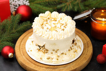 Delicious cake with Christmas decor on table, closeup
