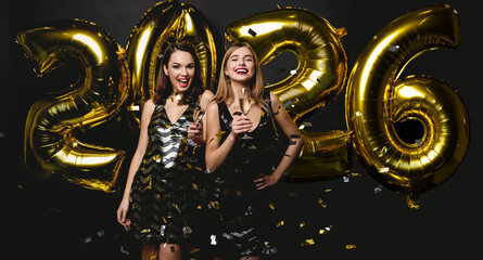 Beautiful Women Celebrating New Year. Happy Girls In Stylish Dresses Holding Gold Balloons, Having...