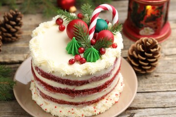 Tasty cake with Christmas decor on wooden table, closeup