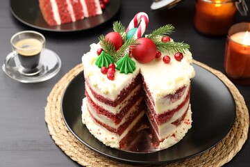 Tasty cake with Christmas decor on black table, closeup