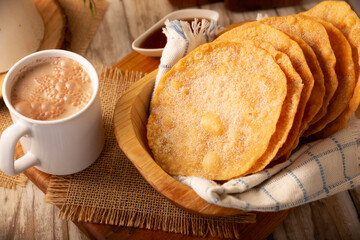 Mexican Buñuelos. Traditional food at Christmas and winter holidays in Mexico, these are fried dough flatbread sprinkled with sugar or covered in a syrup made with piloncillo, cinnamon, and guava.