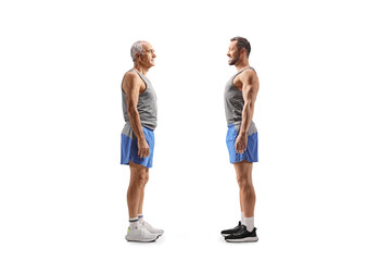 Obraz premium Elderly and young man in sportswear standing and looking at each other