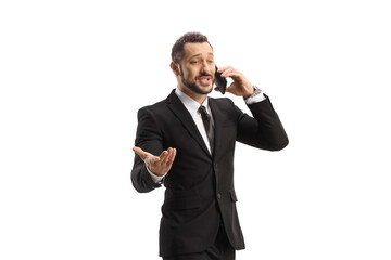 Businessman walking and talking on a mobile phone